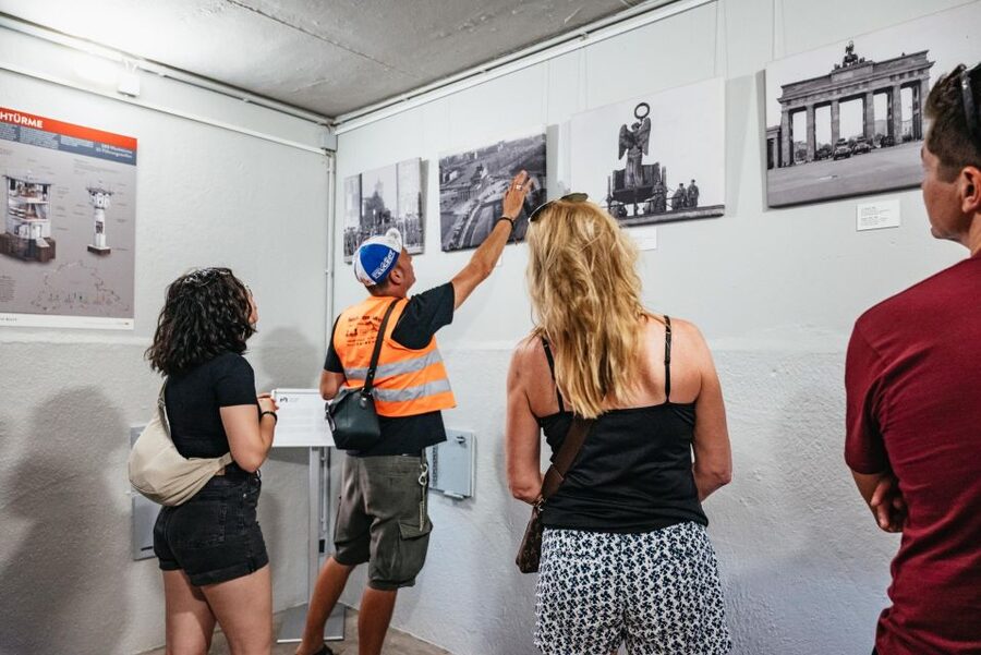 Berlin: Cold War Era History Guided Bike Tour - Checkpoint Charlie, a famous symbol with a complicated role