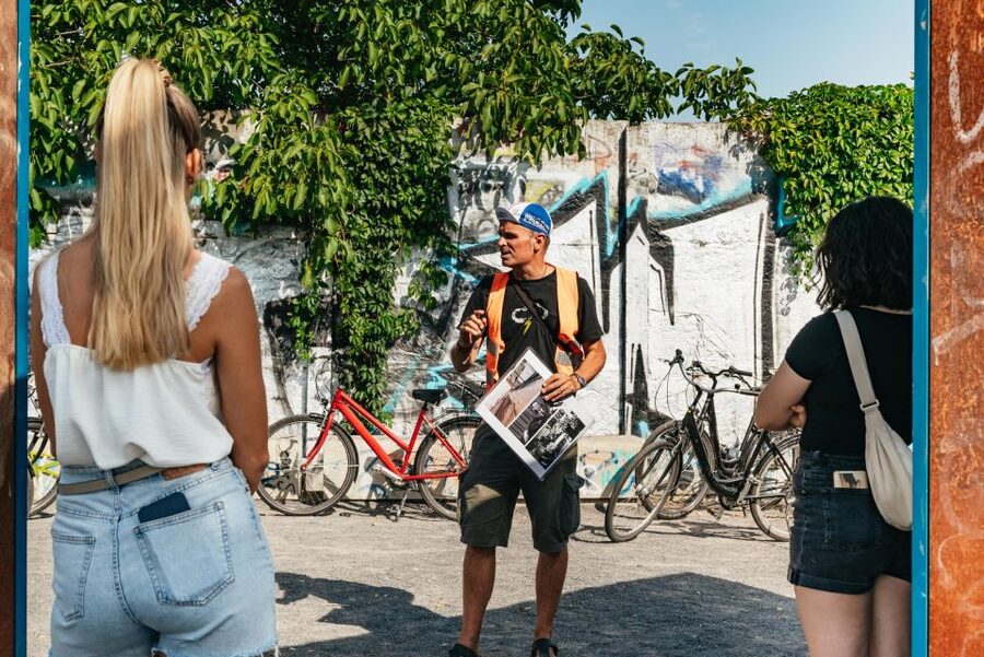 Berlin: Cold War Era History Guided Bike Tour - Riding toward Brandenburg Gate