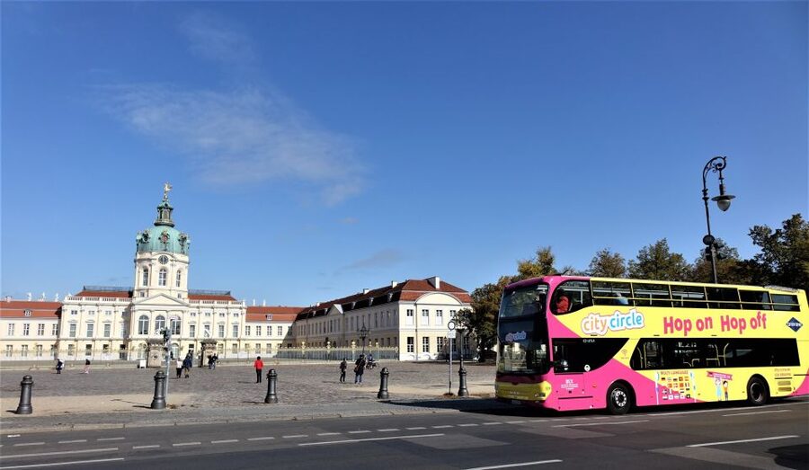 Berlin: East and West Hop-On Hop-Off Bus Tour - Audio, seats, weather, and practical comfort