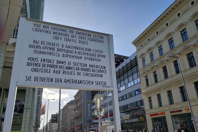 Berlin: Private Highlights Walking Tour with Local Guide and Hotel pickup - Checkpoint Charlie and the divided city