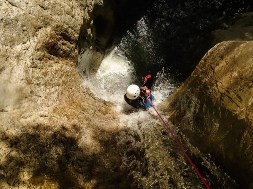 Dornbirn: Kobelach Canyon Exploration and Abseiling Tour - A slide to finish at the canyon edge