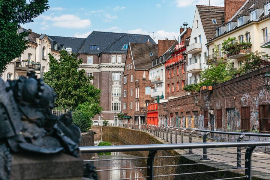 Düsseldorf: Guided Tour with a Night Watchman - Burgplatz and Schlossturm under evening light
