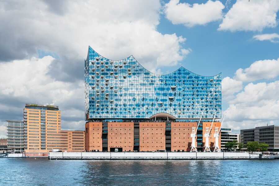 Hamburg: 1-Hour Harbor Sightseeing Cruise with HafenCity - Fischmarkt, cruise ships, and changing harbor scenes