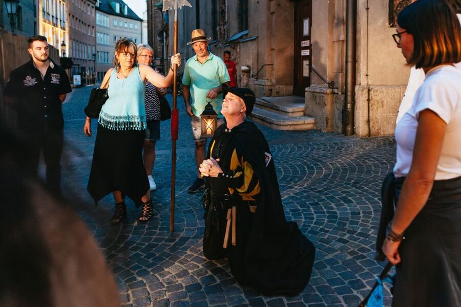 Munich: Middle Ages Tour with Night Watchman - A night watchman with a lantern at Marienplatz