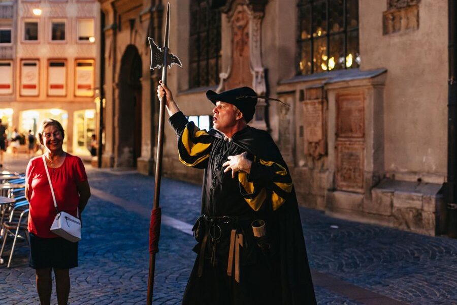Munich: Middle Ages Tour with Night Watchman - Closing the Talburg Gate with a halberd